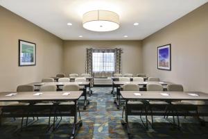 a room with rows of tables and chairs at Candlewood Suites Smyrna - Nashville by IHG in Smyrna +37 photos