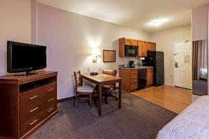 A television and/or entertainment centre at Candlewood Suites Baytown, an IHG Hotel