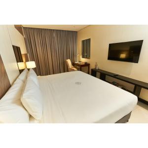 A television and/or entertainment centre at Summit Hotel Tacloban