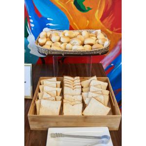 a tray of sandwiches and a basket of eggs at Summit Hotel Tacloban in Tacloban