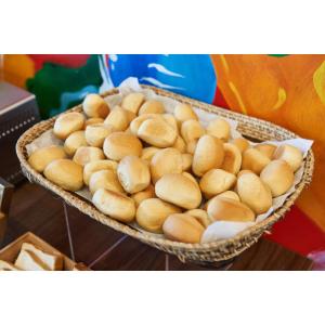 a basket full of buns sitting on a table at Summit Hotel Tacloban in Tacloban
