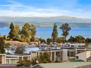 a view of a marina with boats in the water at Taupo Panorama - Lake Taupo Holiday Home in Taupo