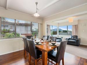a dining room with a table and chairs at Taupo Panorama - Lake Taupo Holiday Home in Taupo