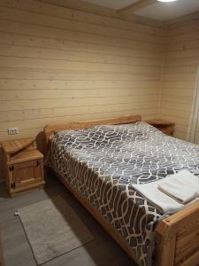 a bed in a corner of a room at Brand NEW 2020 specious apartments DRUZI 3 in Bukovel