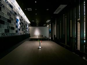 a dark room with a table with a light in it at Hotel Nikko Huis Ten Bosch in Sasebo