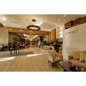 a lobby of a hotel with couches and chairs at Summit Ridge Tagaytay in Tagaytay