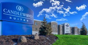 a sign in front of a building at Candlewood Suites Lakeville I-35 by IHG in Lakeville