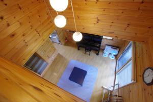 an overhead view of a living room with a piano at Villa Komakusa in Hakuba