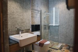 Koupelna v ubytování OU HOTEL