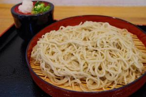 a bowl of noodles sitting on a table at Villa Komakusa in Hakuba