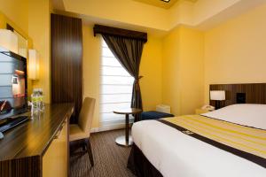 Postel nebo postele na pokoji v ubytování Hotel Monterey Hanzomon
