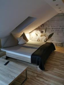 Postel nebo postele na pokoji v ubytování Apartmenthaus Wertheim