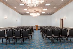 a room with a row of black chairs in it at Holiday Inn Hotel & Suites Oklahoma City North by IHG in Oklahoma City