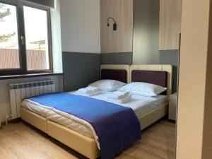 Postel nebo postele na pokoji v ubytování Hotel IRIS