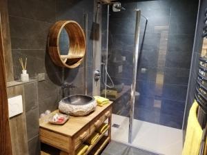 a bathroom with a shower with a sink and a bowl at Chambres et Tables d'Hôtes Le Choton à Nono - Col du Joly Beaufortain in Hauteluce