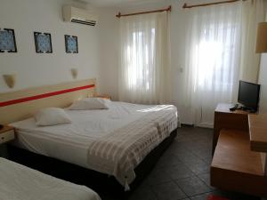 Postel nebo postele na pokoji v ubytování Serhan Hotel
