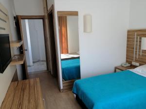 Postel nebo postele na pokoji v ubytování Serhan Hotel