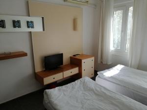 Postel nebo postele na pokoji v ubytování Serhan Hotel