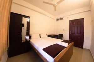 a bedroom with a large bed in a room at Noah's Ark in Cochin