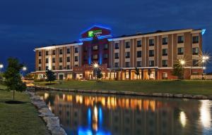 a rendering of a hotel at night at Holiday Inn Express & Suites Glenpool, an IHG Hotel in Glenpool