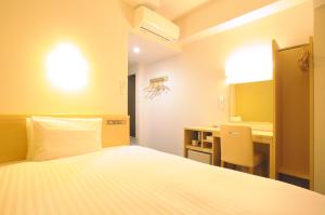 Кровать или кровати в номере AB Hotel Tokai Otagawa