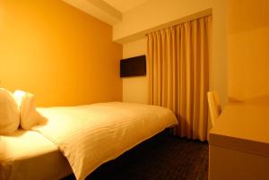 Postel nebo postele na pokoji v ubytování AB Hotel Fuji