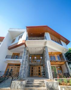 an exterior view of a building with stairs at 3 Arch Resort Ella in Ella