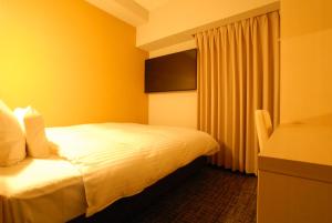 Postel nebo postele na pokoji v ubytování AB Hotel Fuji