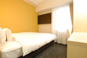 Postel nebo postele na pokoji v ubytování AB Hotel Fuji