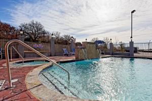 a swimming pool with a water slide at Holiday Inn Express & Suites Graham, an IHG Hotel in Graham