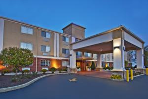 a hotel building with a parking lot in front of it at Holiday Inn Express Hotel & Suites Wabash, an IHG Hotel in Wabash