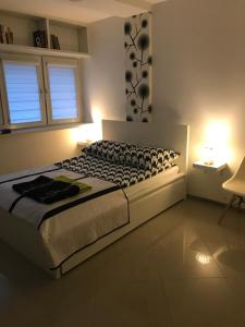 Giường trong phòng chung tại Kazimir Apartament Lodz