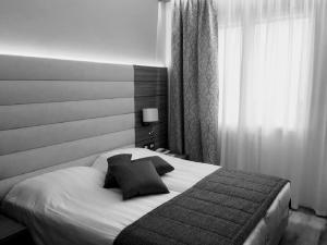 Cama ou camas em um quarto em Hotel Belvedere