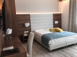Cama ou camas em um quarto em Hotel Belvedere
