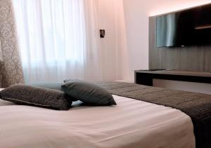 Cama ou camas em um quarto em Hotel Belvedere
