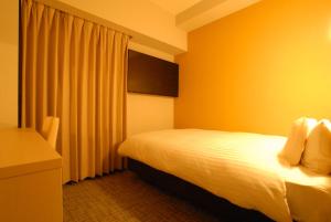 Postel nebo postele na pokoji v ubytování AB Hotel Fuji