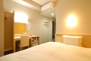 Postel nebo postele na pokoji v ubytování AB Hotel Fuji