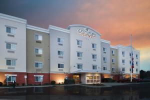 a rendering of the embassy suites hotel at dusk at Candlewood Suites Wake Forest-Raleigh Area, an IHG Hotel in Wake Forest