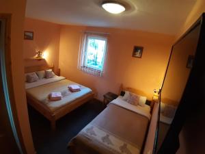 Ліжко або ліжка в номері Vila Palma Palic