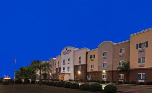a hotel at night with a blue sky at Candlewood Suites - Texas City, an IHG Hotel in Texas City