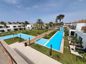 an overhead view of a swimming pool at a resort at Kalimba Beach Resort in Kotu
