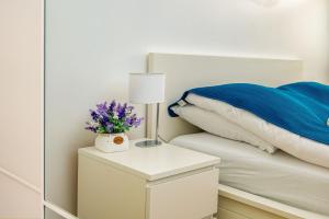 Posteľ alebo postele v izbe v ubytovaní Apartament Zatoka