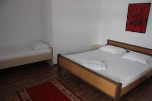 מיטה או מיטות בחדר ב-Casa Panoramic