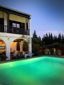 a large swimming pool in front of a house at El Molino Estepona in Estepona