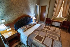 Postel nebo postele na pokoji v ubytování Exis Hotel