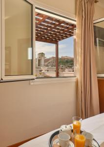 Fotografie z fotogalerie ubytování Athos Hotel v Aténách