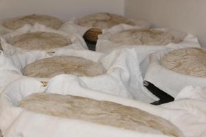 A bed or beds in a room at Berggasthof - Pension Lahnerhof