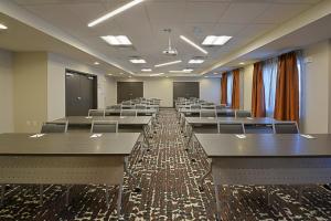 a large room with tables and chairs in it at Staybridge Suites - Little Rock - Medical Center by IHG in Little Rock