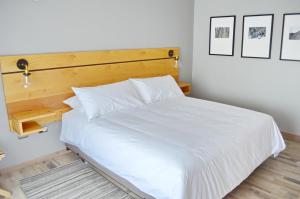 Rúm í herbergi á Hotel Cinco Tierras