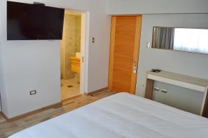 Rúm í herbergi á Hotel Cinco Tierras